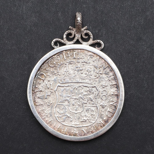 1006 - A SPANISH SILVER 8 REALES COIN FROM THE HOLLANDIA IN AN ENGRAVED MOUNT. A Spanish 8 Reales, Madrid m... 