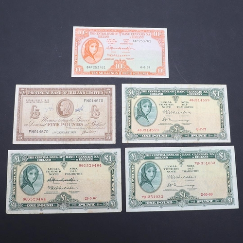 1202 - A COLLECTION OF FIVE IRISH BANKNOTES. Three Central Bank of Ireland green £1 notes, a similar orange... 