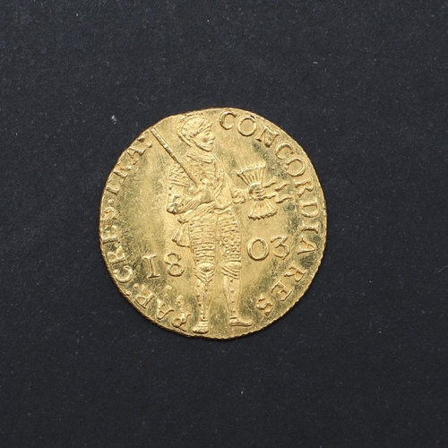 1215 - A FINE DUTCH GOLD DUCAT, 1803. Standing figure in armour r. holding seven arrows and a sword, flanke... 