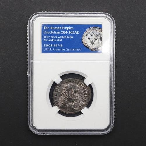 703 - A ROMAN FOLLIS OF DIOCLETIAN (284-305). A billon silver washed follis from the Alexandria Mint, slab... 