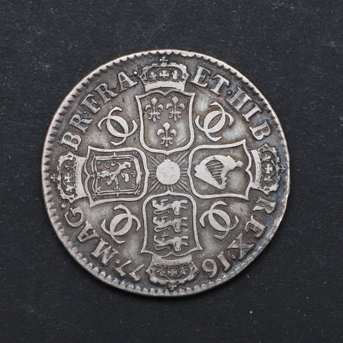 741 - A CHARLES II HALFCROWN, 1677. A Charles II Halfcrown, fourth draped bust r. Reverse with conjoined '... 