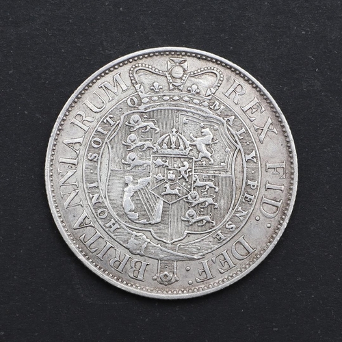 810 - A GEORGE III HALFCROWN, 1819. A George III Halfcrown, small laureate head r. dated 1819, reverse wit... 