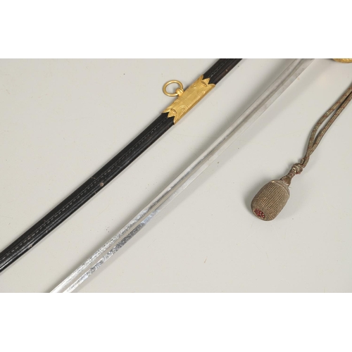 100 - AN IMPERIAL GERMAN NAVAL OFFICER's  SWORD AND SCABBARD. With an 83cm curved, pointed blade with long... 