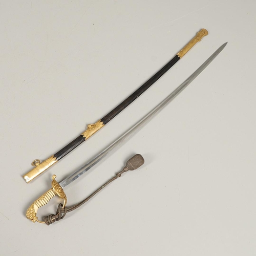 100 - AN IMPERIAL GERMAN NAVAL OFFICER's  SWORD AND SCABBARD. With an 83cm curved, pointed blade with long... 