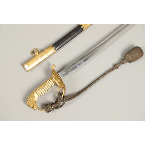 100 - AN IMPERIAL GERMAN NAVAL OFFICER's  SWORD AND SCABBARD. With an 83cm curved, pointed blade with long... 