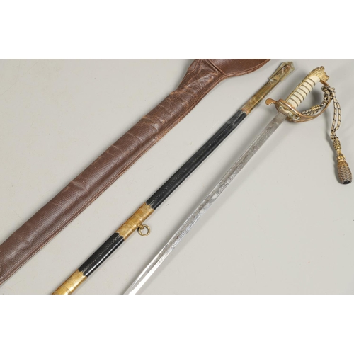 101 - AN ELIZABETH II NAVAL OFFICER's  SWORD BY GIEVES. A naval officer's  sword with a 79cm pointed and f... 