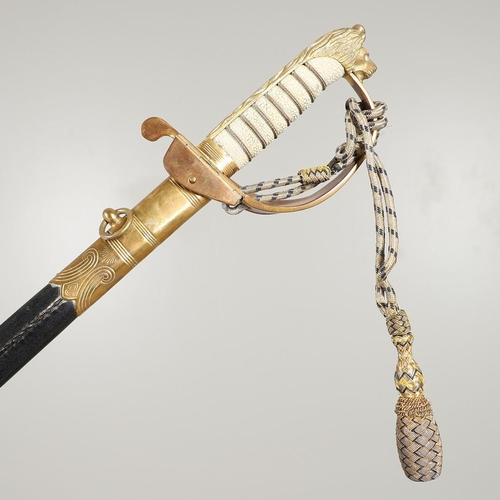 101 - AN ELIZABETH II NAVAL OFFICER's  SWORD BY GIEVES. A naval officer's  sword with a 79cm pointed and f... 