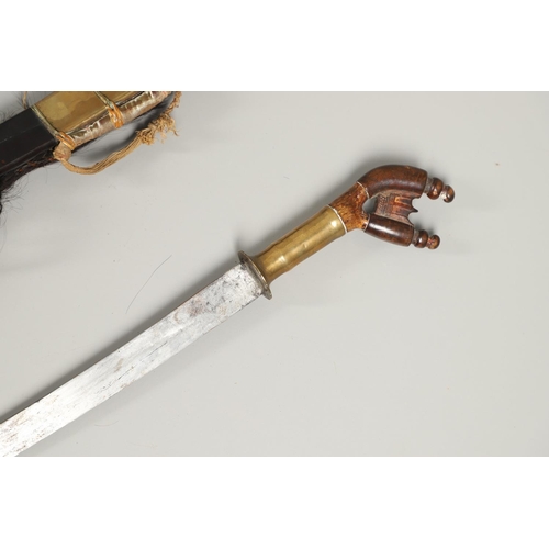 109 - A FINE MURUT TYPE SWORD AND SCABBARD FROM NORTHERN BORNEO. With a 65cm curved steel blade with a sha... 