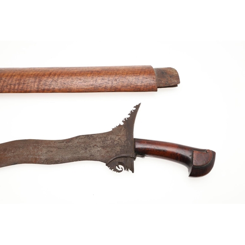 112 - TWO MALAYAN KRIS TYPE SHORT SWORDS AND SCABBARDS. With a 36c, wavy edged blade and elaborately carve... 