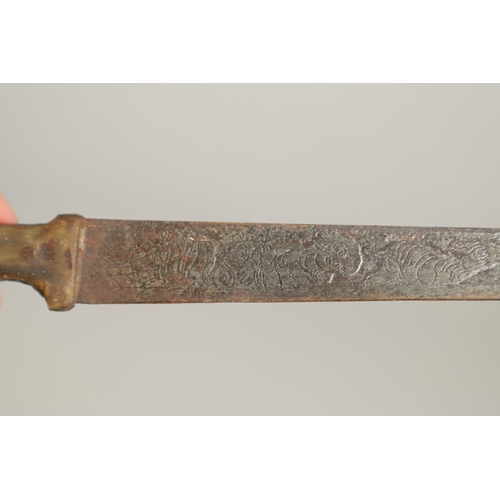 114 - A 19TH CENTURY HORN HANDLED KNIFE OR SHORT SWORD, POSSIBLY INDIAN. With a 36cm pointed blade decorat... 