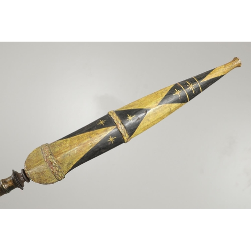 119 - AN INDONESIA SPEAR OR LANCE WITH WAVY EDGED BLADE AND PAINTED SCABBARD. The 31cm wavy edged, taperin... 