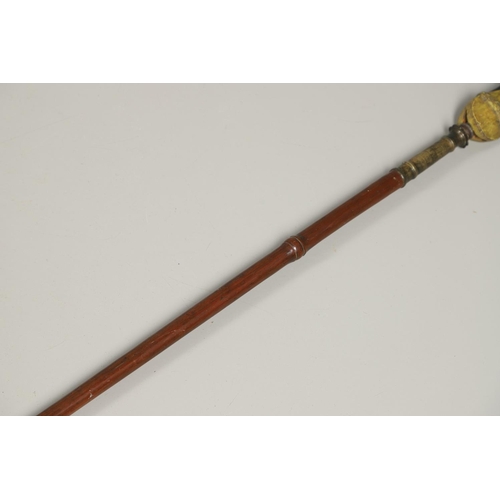 119 - AN INDONESIA SPEAR OR LANCE WITH WAVY EDGED BLADE AND PAINTED SCABBARD. The 31cm wavy edged, taperin... 