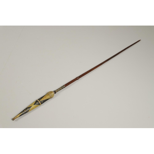 119 - AN INDONESIA SPEAR OR LANCE WITH WAVY EDGED BLADE AND PAINTED SCABBARD. The 31cm wavy edged, taperin... 