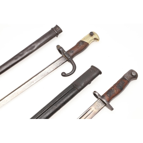 126 - A FRENCH 1874 PATTERN GRAS BAYONET AND SCABBARD AND SIMILAR BRITISH 1907 PATTERN BAYONET. A 19th cen... 