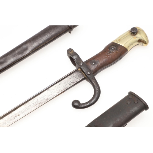 126 - A FRENCH 1874 PATTERN GRAS BAYONET AND SCABBARD AND SIMILAR BRITISH 1907 PATTERN BAYONET. A 19th cen... 