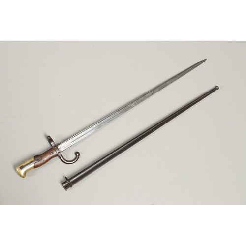 127 - A FRENCH GRAS 1874 PATTERN SWORD BAYONET AND SCABBARD. With a 52cm single edged, pointed blade, engr... 