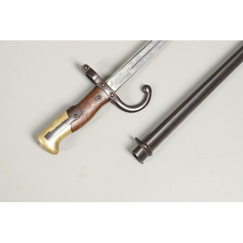 127 - A FRENCH GRAS 1874 PATTERN SWORD BAYONET AND SCABBARD. With a 52cm single edged, pointed blade, engr... 