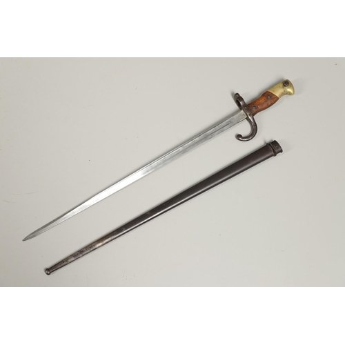 127 - A FRENCH GRAS 1874 PATTERN SWORD BAYONET AND SCABBARD. With a 52cm single edged, pointed blade, engr... 