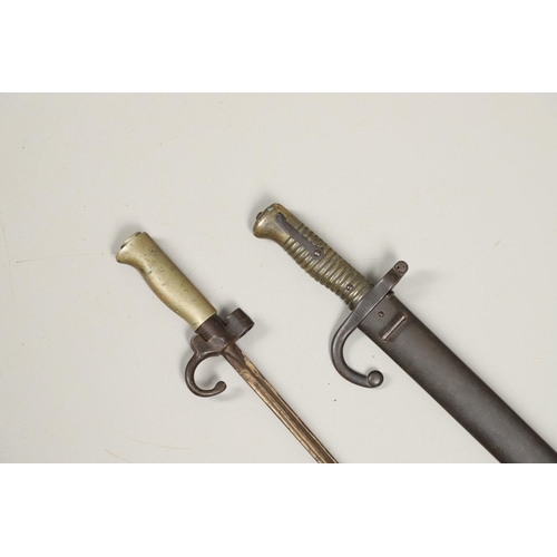 131 - A FRENCH 1886 PATTERN LEBEL EPEE BAYONET AND SIMILAR SWORD BAYONET AND SCABBARD. An Epee baynoet wit... 