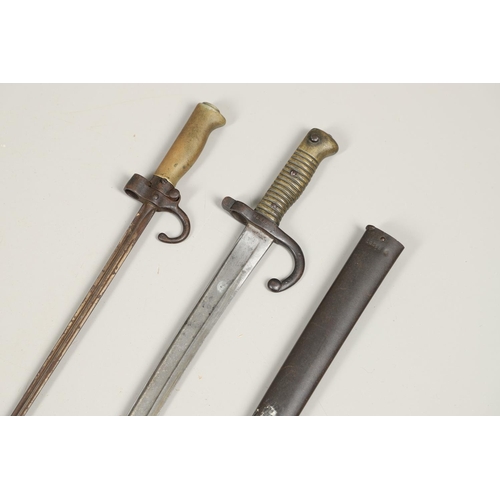 131 - A FRENCH 1886 PATTERN LEBEL EPEE BAYONET AND SIMILAR SWORD BAYONET AND SCABBARD. An Epee baynoet wit... 