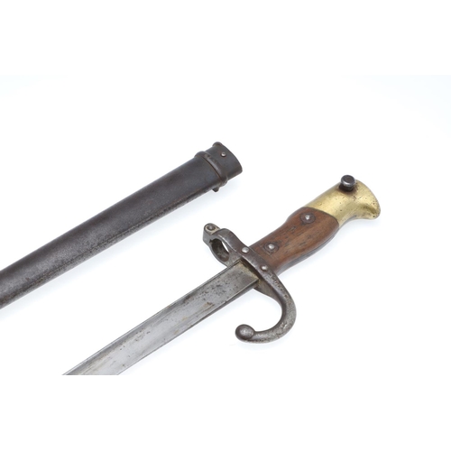 136 - A 19TH CENTURY FRENCH M1874 SWORD BAYONET AND SCABBARD. With a tapering 52cm blade with broad back, ... 