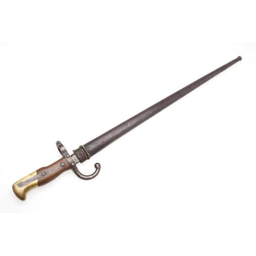 136 - A 19TH CENTURY FRENCH M1874 SWORD BAYONET AND SCABBARD. With a tapering 52cm blade with broad back, ... 