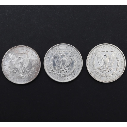 957 - THREE AMERICAN MORGAN DOLLARS, 1879 AND LATER. Three United States of America Morgan Dollars, 1879, ... 