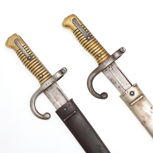 137 - TWO SIMILAR M1866 PATTERN CHASSEPOT SWORD BAYONETS AND SCABBARDS. A bayonet and scabbard with a 57cm... 