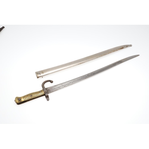 137 - TWO SIMILAR M1866 PATTERN CHASSEPOT SWORD BAYONETS AND SCABBARDS. A bayonet and scabbard with a 57cm... 