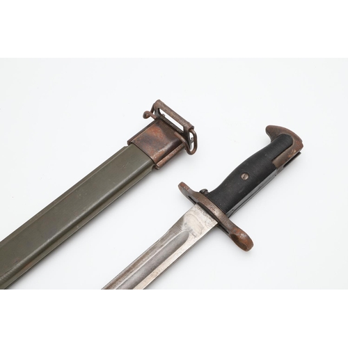 140 - AN AMERICAN 1903 PATTERN BAYONET AND SCABBARD. With a 25cm pointed single edged blade with broad ful... 