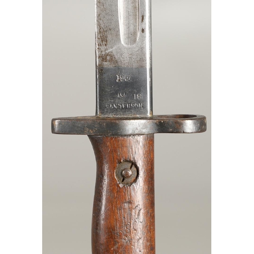 143 - A 1907 LEE ENFIELD BAYONET AND SCABBARD. With a 43cm pointed, single edged and fullered blade marked... 