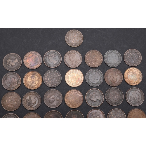 992 - A COLLECTION OF CANADIAN 1 CENT COINS 1858 AND LATER. Canadian 1 Cents, Queen Victoria, laureate bus... 