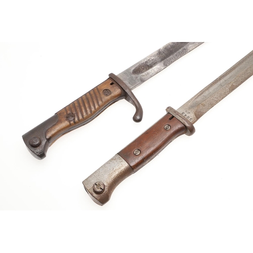 152 - A FIRST WORLD WAR GERMAN BAYONET AND A SIMILAR SECOND WORLD WAR EXAMPLE. A German 1905/16 'Butcher' ... 