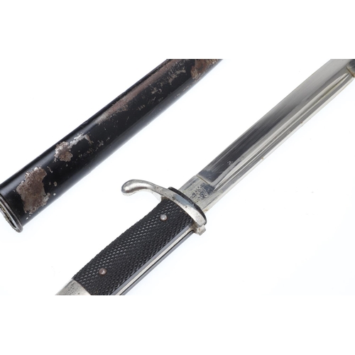 154 - A SECOND WORLD WAR GERMAN PARADE BAYONET AND SCABBARD. With a 19cm pointed, single edged blade marke... 