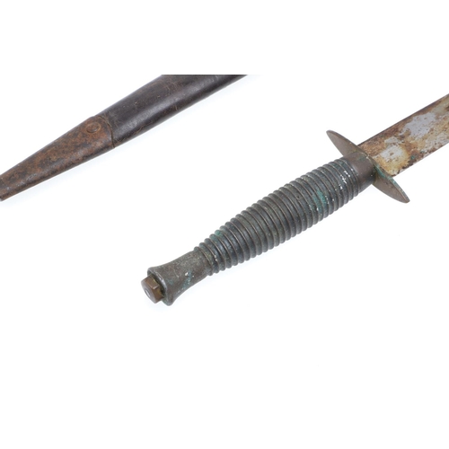 175 - A THIRD PATTERN FAIRBURN SYKES TYPE FIGHTING KNIFE. With a 17cm double edged pointed blade on a flut... 