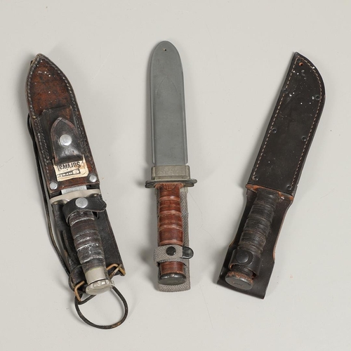 179 - AN AMERICAN MK2 FIGHTING KNIFE AND TWO OTHERS. A Camillus N.Y. U.S.N Mark 2 knife with a 17.5 cm bow... 