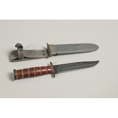 179 - AN AMERICAN MK2 FIGHTING KNIFE AND TWO OTHERS. A Camillus N.Y. U.S.N Mark 2 knife with a 17.5 cm bow... 