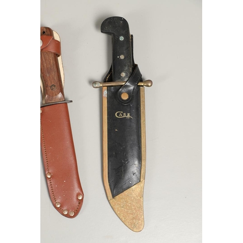 182 - AN AMERICAN CASE HUNTING KNIFE AND THREE OTHERS. A Case hunting knife with a 24cm plated Bowie type ... 