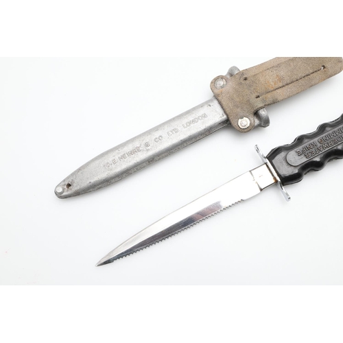 187 - A SIEBE- HEINKE DIVERS KNIFE AND SCABBARD. With a 15cm pointed blade with a single serrated edge, th... 