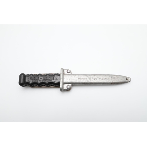 187 - A SIEBE- HEINKE DIVERS KNIFE AND SCABBARD. With a 15cm pointed blade with a single serrated edge, th... 