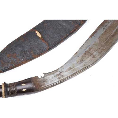 189 - A BROAD BLADED KUKRI KNIFE AND SCABBARD. With a 40cm blade, 7cm broad at the widest point with broad... 