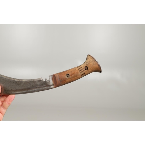 190 - TWO SIMILAR KUKRI KNIVES AND SCABBARDS. A Kukri knife with a shaped 30cm blade with pricked decorati... 