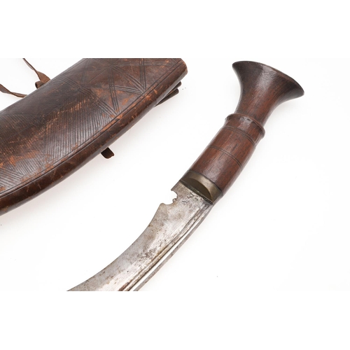 191 - TWO KUKRI KNIVES AND SCABBARDS. A Kukri knife with a 38cm sharpened blade on a wooden handle, in a l... 