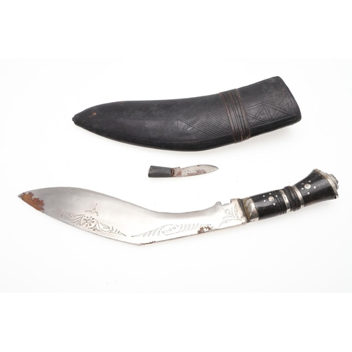 191 - TWO KUKRI KNIVES AND SCABBARDS. A Kukri knife with a 38cm sharpened blade on a wooden handle, in a l... 