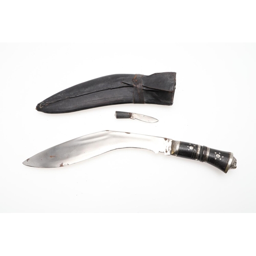 191 - TWO KUKRI KNIVES AND SCABBARDS. A Kukri knife with a 38cm sharpened blade on a wooden handle, in a l... 