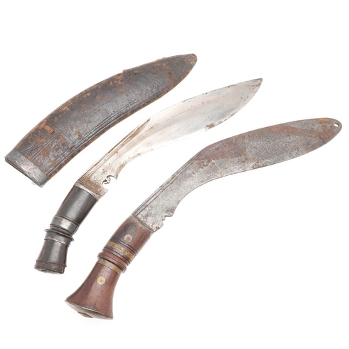 195 - A BROAD BLADE KUKRI KNIFE AND SCABBARD AND ANOTHER SIMILAR. With a 29cm broad shaped blade with shar... 