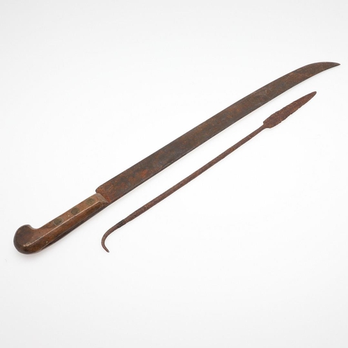 199 - A MACHETE AND AFRICAN SPEAR POINT. A British made Machete with 54cm blade with single edge and uptur... 