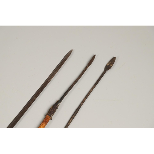 200 - A LONG BLADED HUNTING SPEAR, POSSIBLY MASSAI AND THREE OTHERS. A long bladed spear with a pointed ti... 