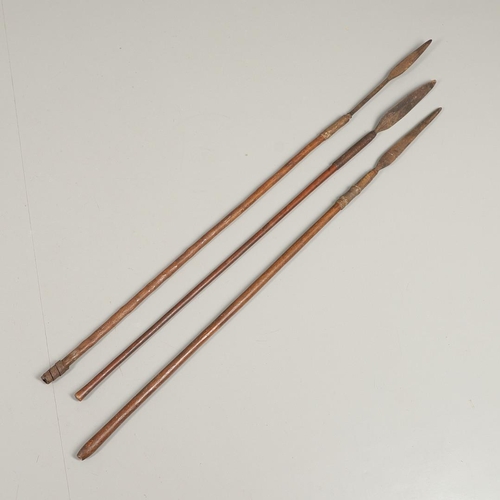 201 - THREE AFRICAN THROWING SPEARS. An African spear with a leaf shaped point on square shaft and wooden ... 