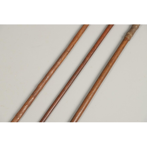 201 - THREE AFRICAN THROWING SPEARS. An African spear with a leaf shaped point on square shaft and wooden ... 